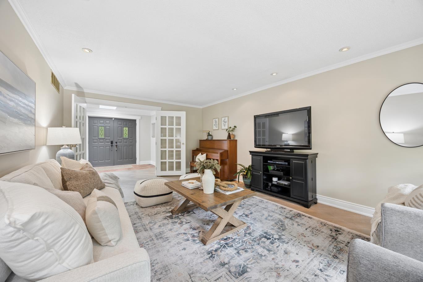 Living room looking toward the foyer and front entry at 30 Potters Lane